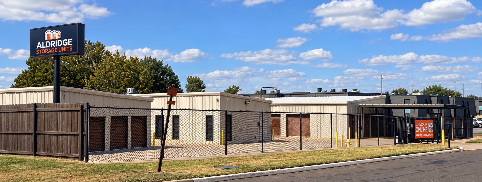Aldridge Storage Units sign and fenced storage buildings at the Midwest City facility
